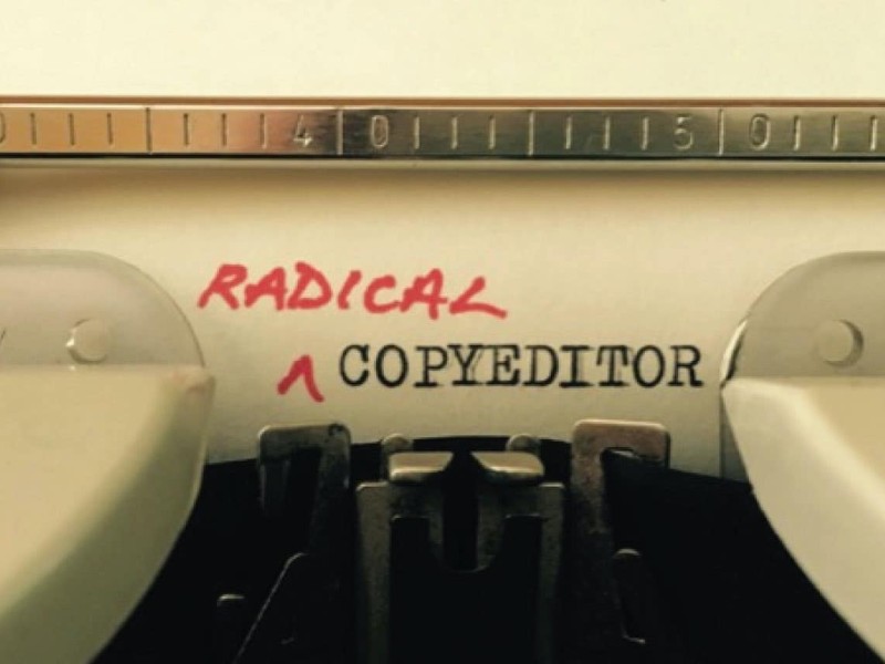 A photo of a typewriter with "Copyeditor" typed out. In red, "Radical" is inserted before it so the text on paper reads Radical Copywriter.