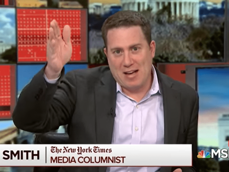 A screencap of New York Times media columnist Ben Smith, a white man with close-cut brown hair in a suit, on MSNBC.