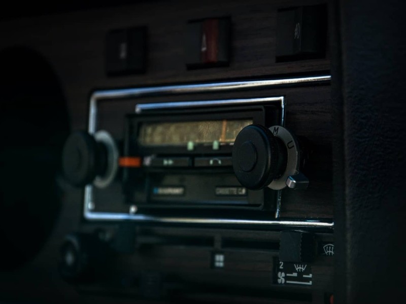 A close-up of a car radio's control panel.