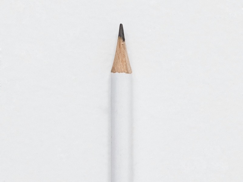 A close-up on a white pencil.