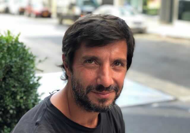 A photo portrait of Pablo Calvi, a journalism professor at Stony Brook University.