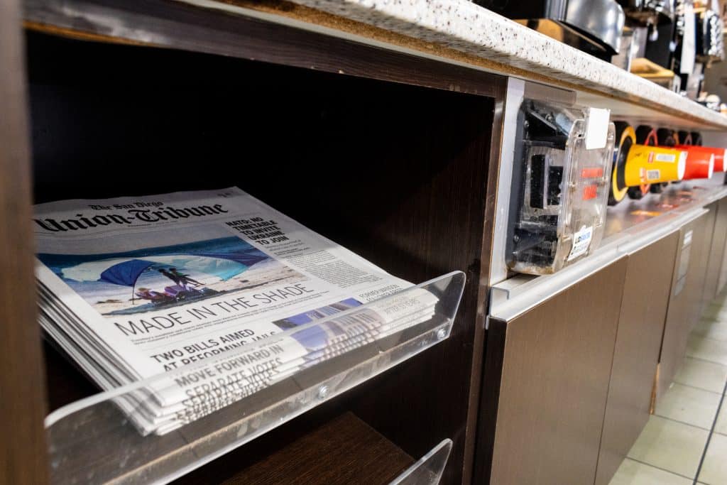 A stack of The San Diego Union-Tribune newspapers is displayed at a Circle K gas station in Chula Vista, California.