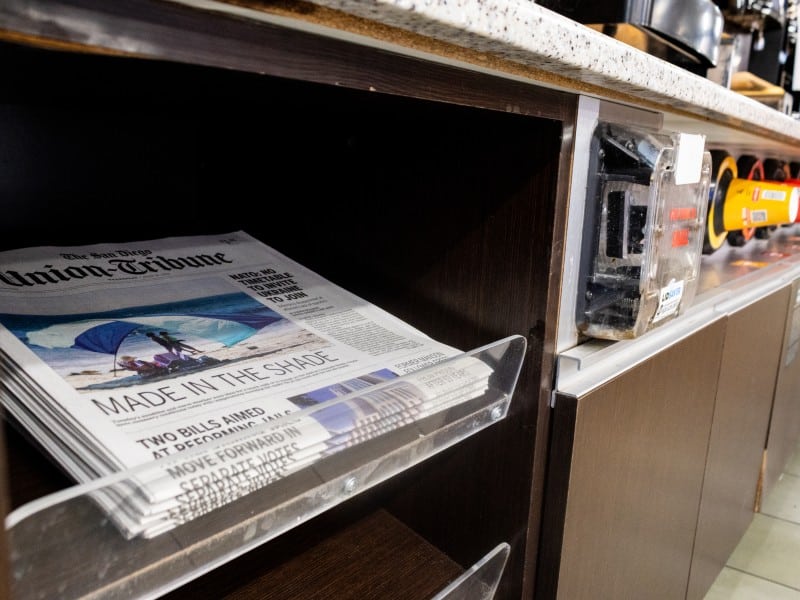 A stack of The San Diego Union-Tribune newspapers is displayed at a Circle K gas station in Chula Vista, California.