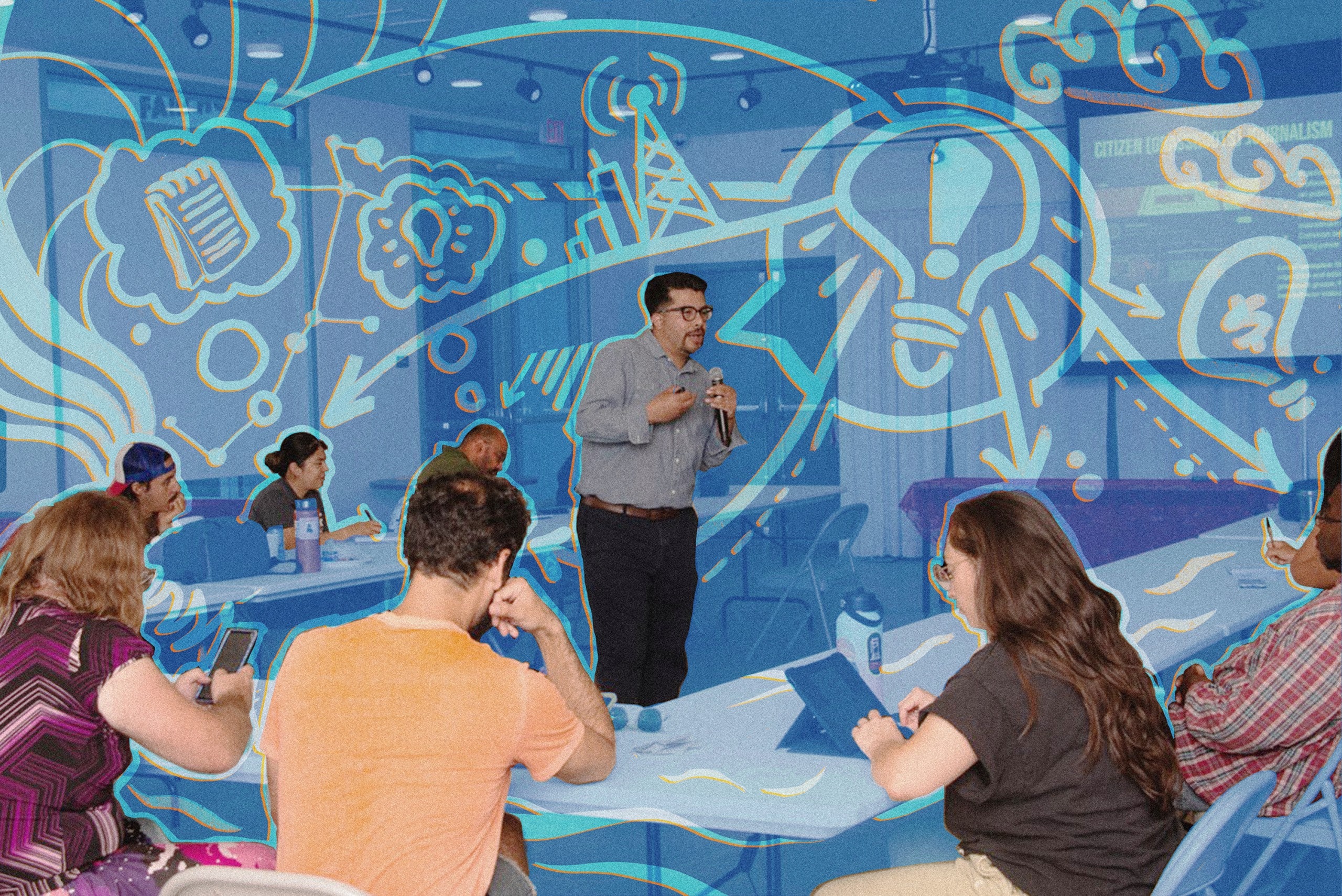 Anthony Victoria, a Latino man wearing a blue button-down and black pants, is holding a microphone and teaching at the center of a filled classroom. A blue transparent overlay is on the image with orange accents around the crowd and Anthony.