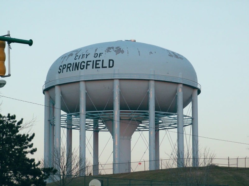A photo of a water tower reading "city of Springfield."