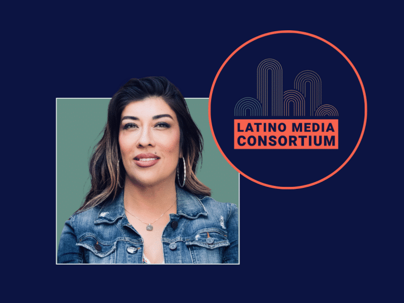 Lucy Flores, a Latina woman with brunette hair and blonde highlights, smiles at the camera. She is wearing a denim jacket in her headshot. The logo of the Latino Media Consortium is placed next to her.